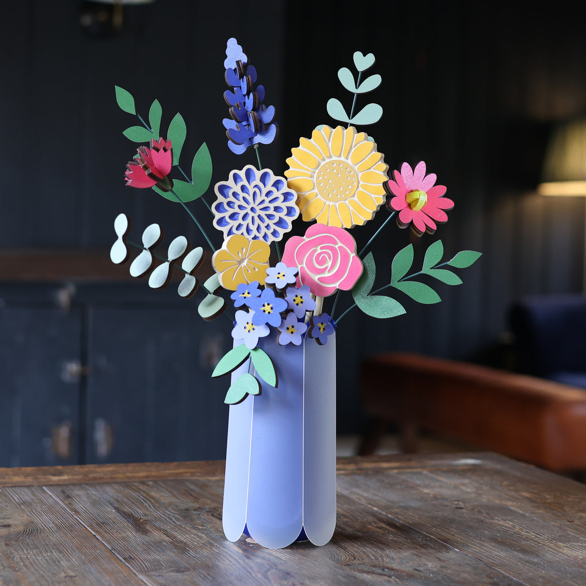 Statement Blooms in Fruit Salad, eight wooden blooms and five foliage sprigs in mixed brights, styled in a room