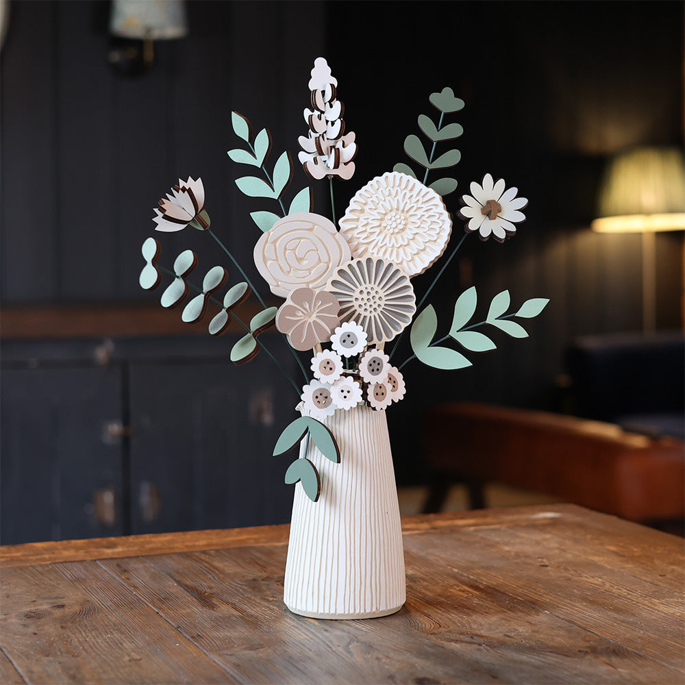 Statement Blooms in Toasted Marshmallow, eight wooden blooms and five foliage sprigs in soft cream and caramel, styled in a room 