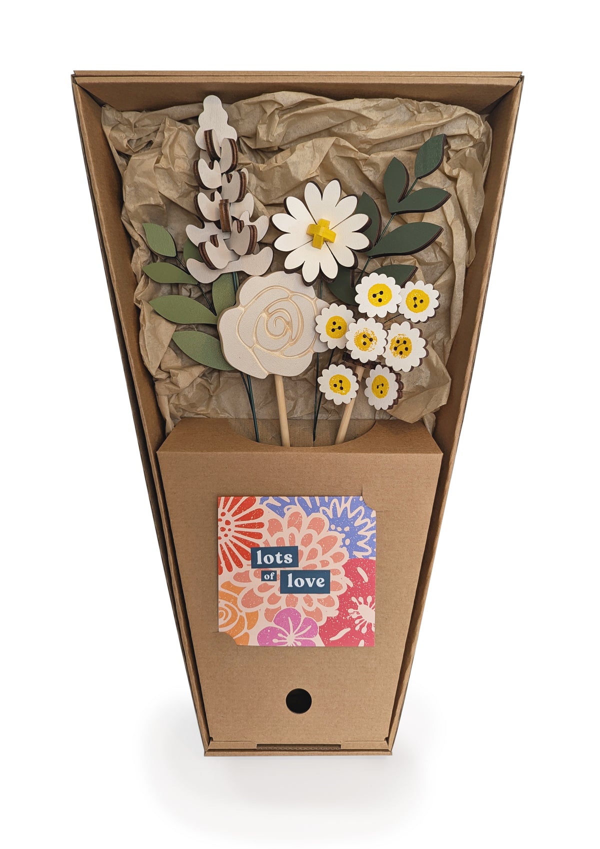 Signature Blooms in Sunny Side, four wooden blooms and two foliage stems in grey and white with a touch of sunshine yellow, in its open box with the stems held in place 