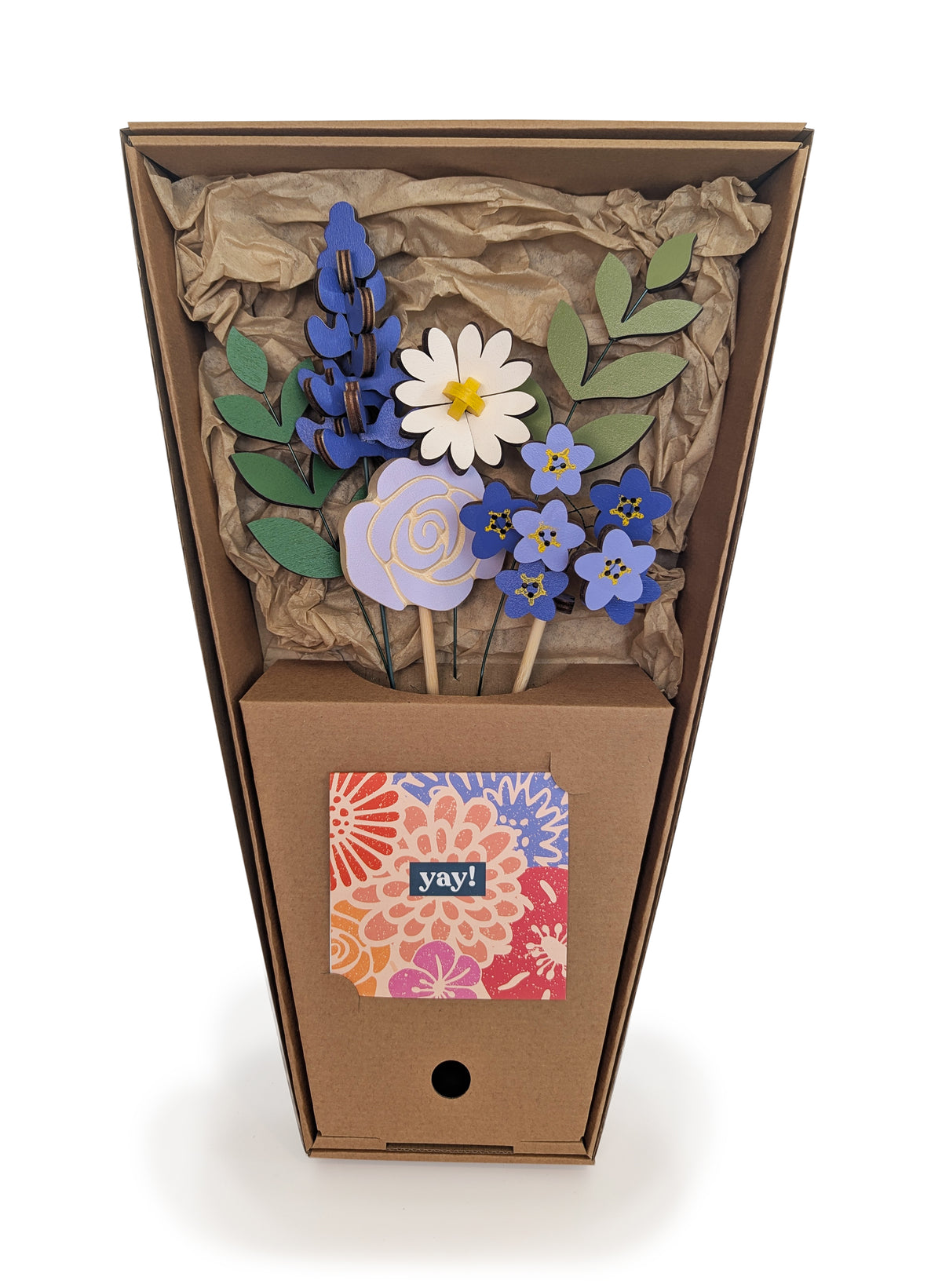 Signature Blooms in Parma Violet, four wooden blooms and two foliage stems in violet and lilac, in its open box with the stems held in place 
